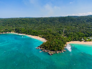 an aerial view of a tropical island in the middle of the ocean