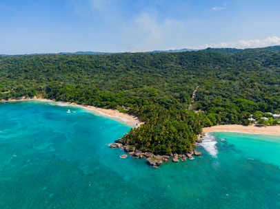 an aerial view of a tropical island in the middle of the ocean