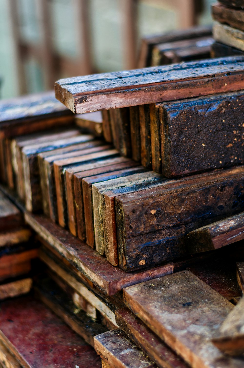 a pile of wooden planks stacked on top of each other