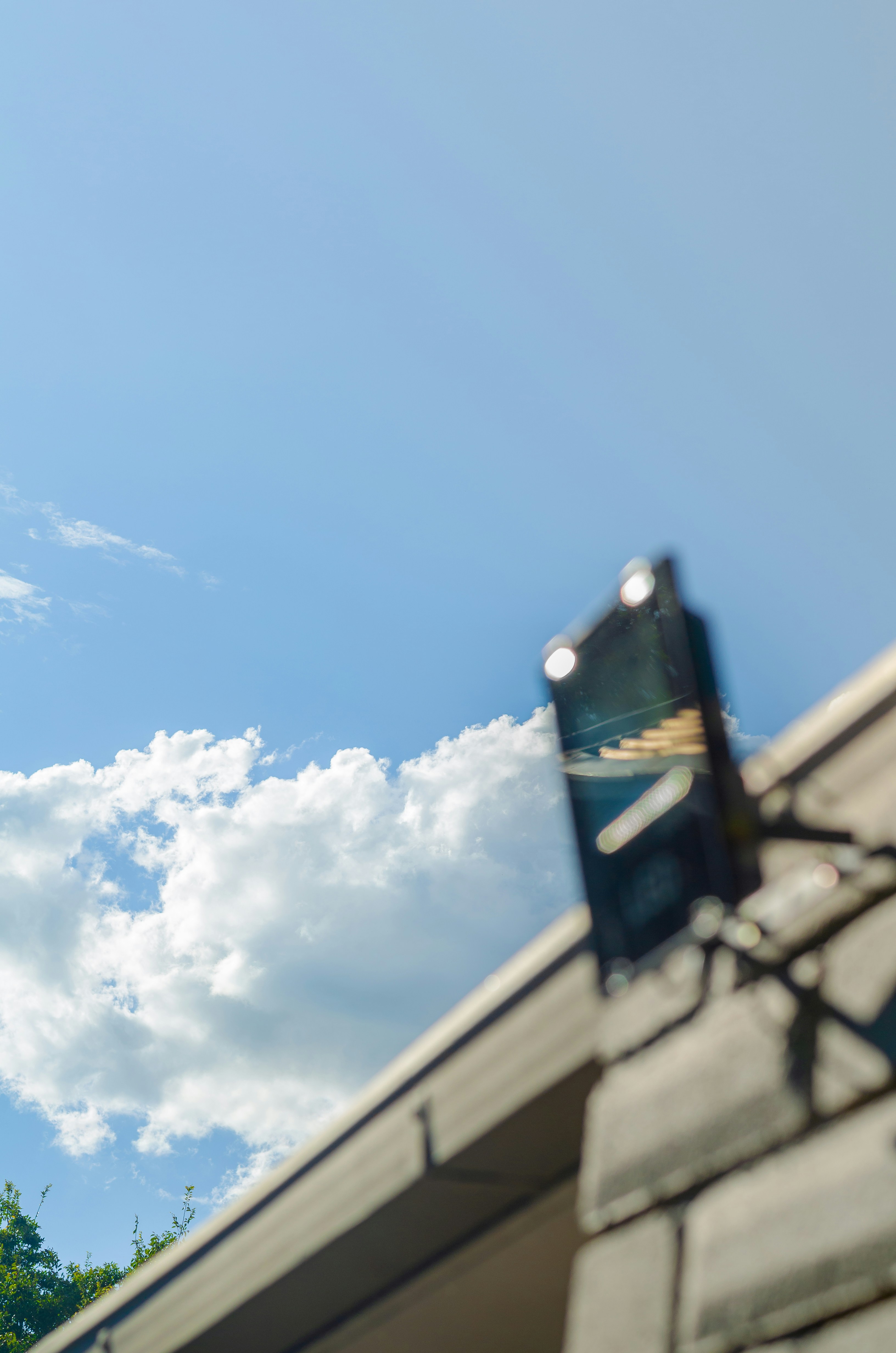 a clock on the side of a building with trees in the background