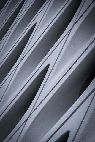 Close-up of a black and light grey geometric pattern representing precision and balance.