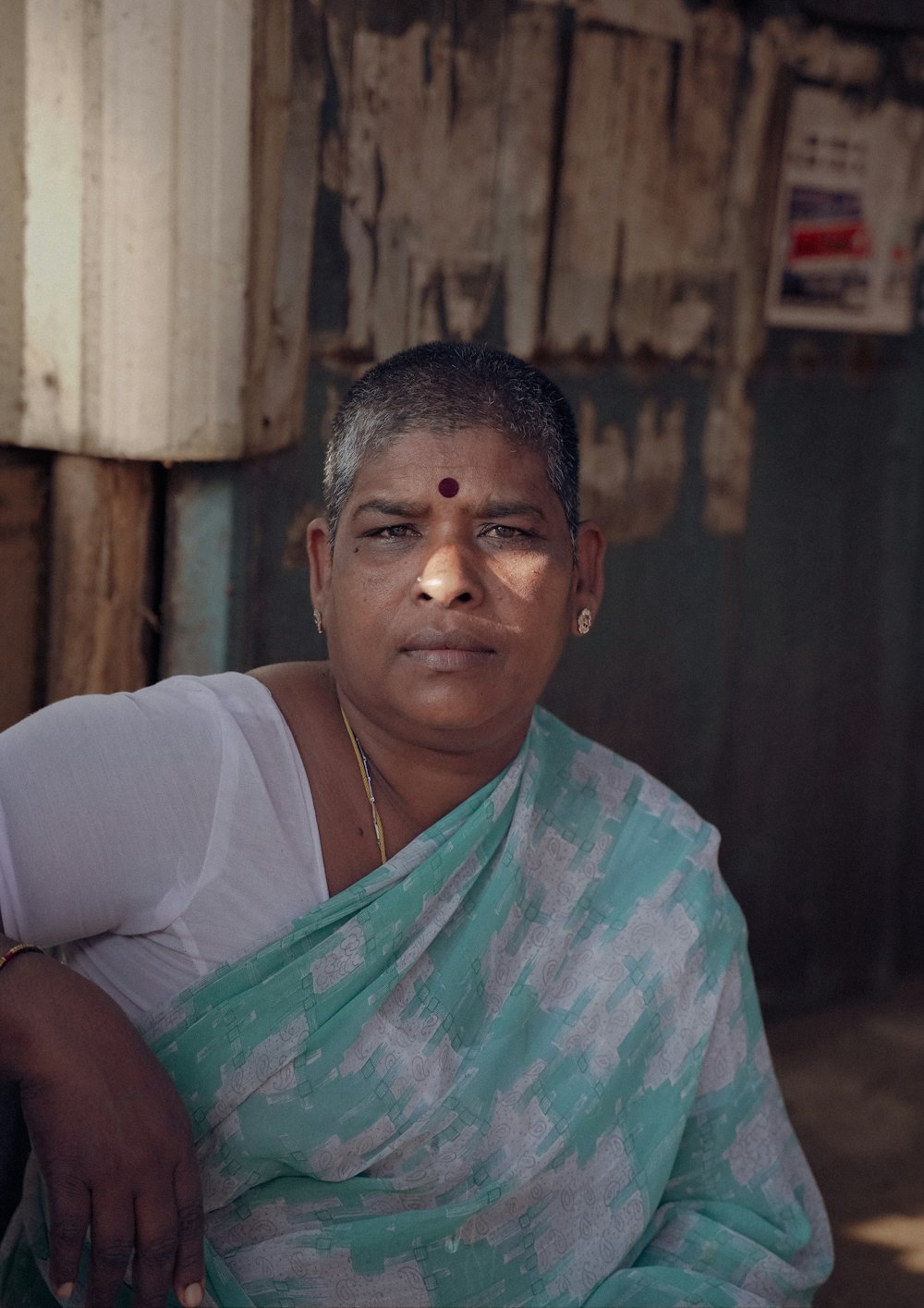 a woman in a green and white sari