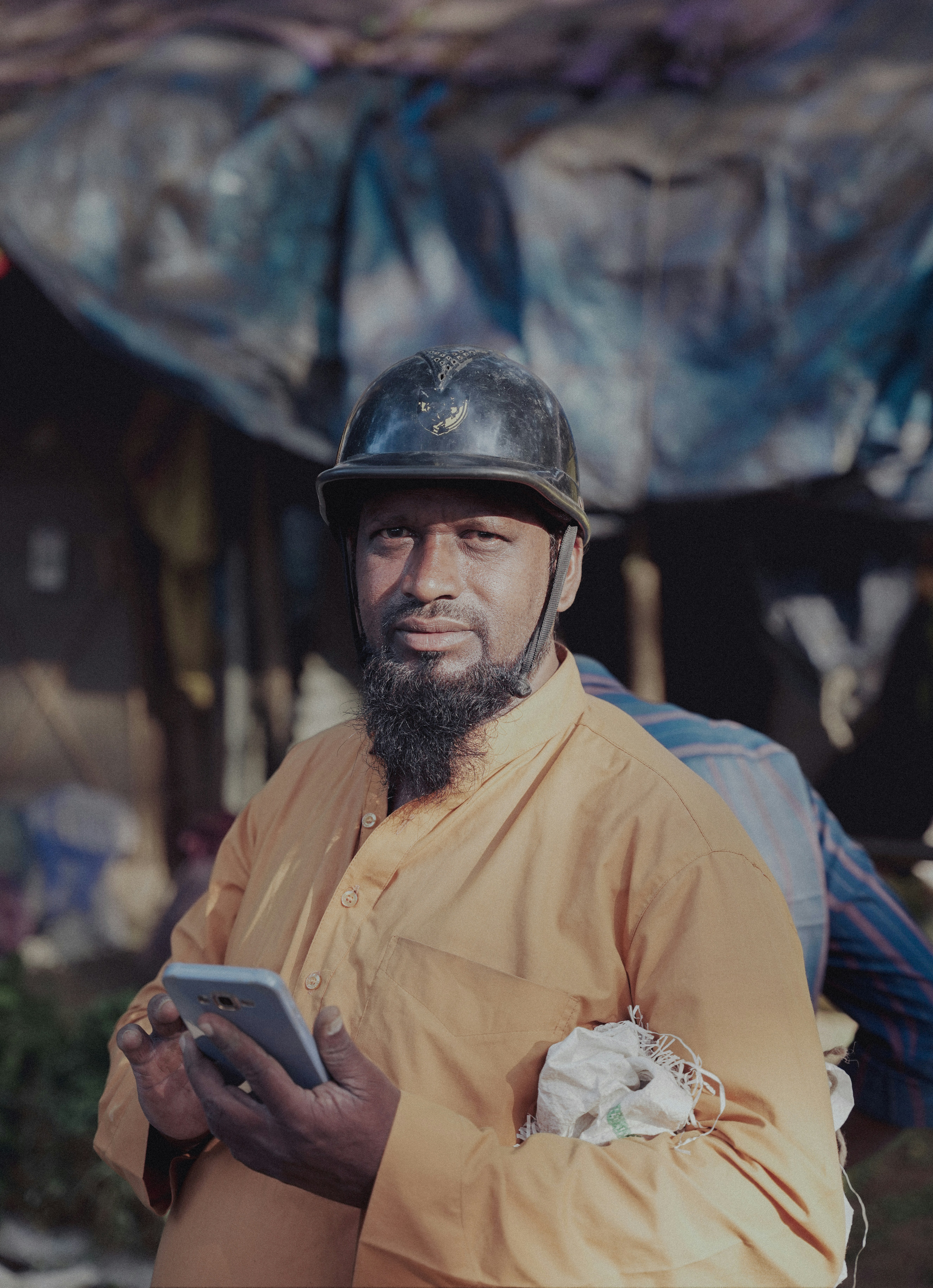 Field crew management software being reviewed by a construction foreman on a commercial jobsite