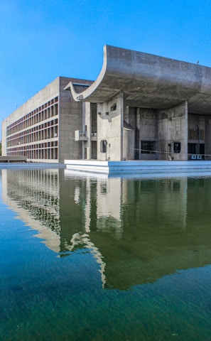 a large building sitting next to a body of water