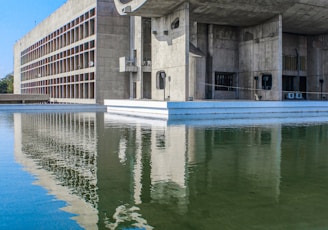 a large building sitting next to a body of water