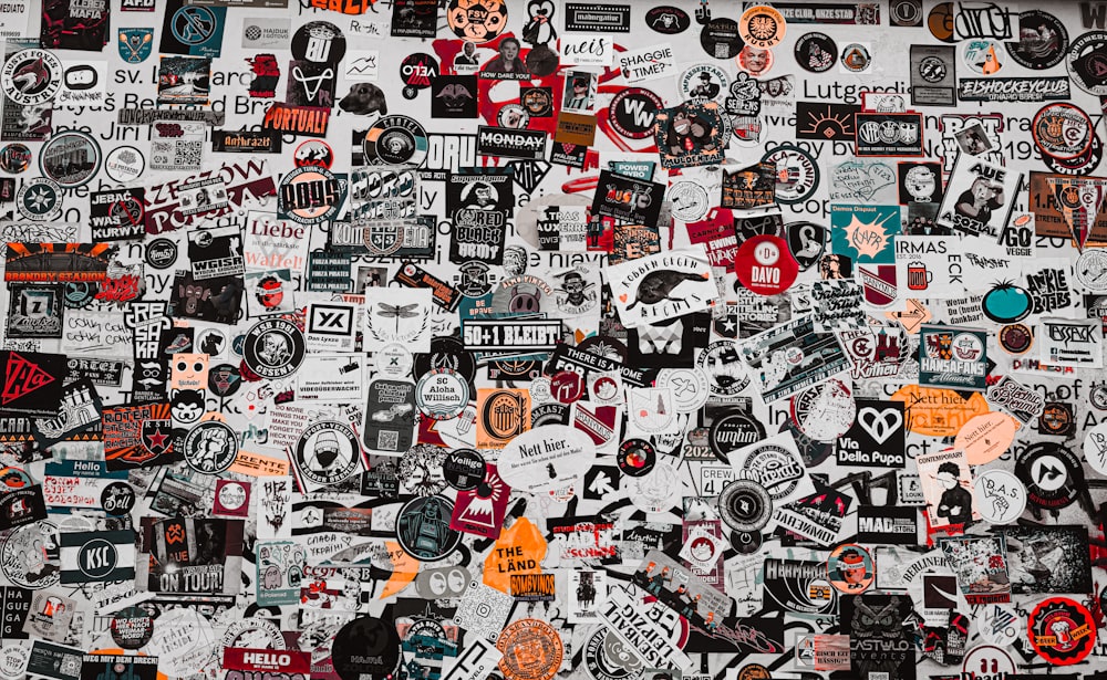 a wall covered in lots of different types of stickers