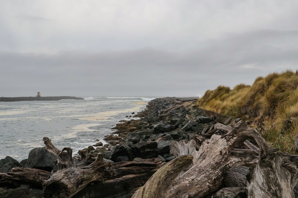 a view of the ocean from a rocky shore