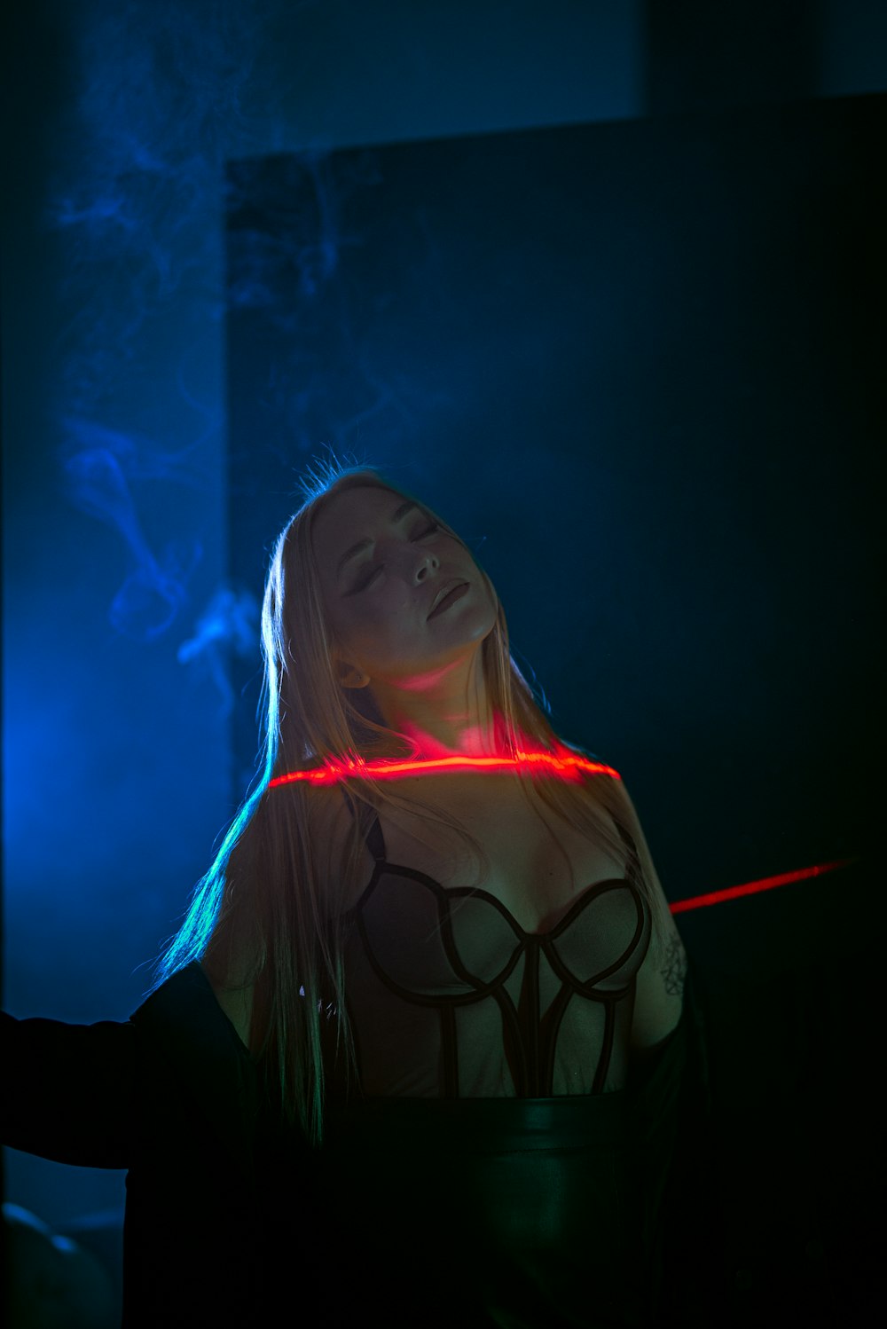 a woman with a red light around her neck