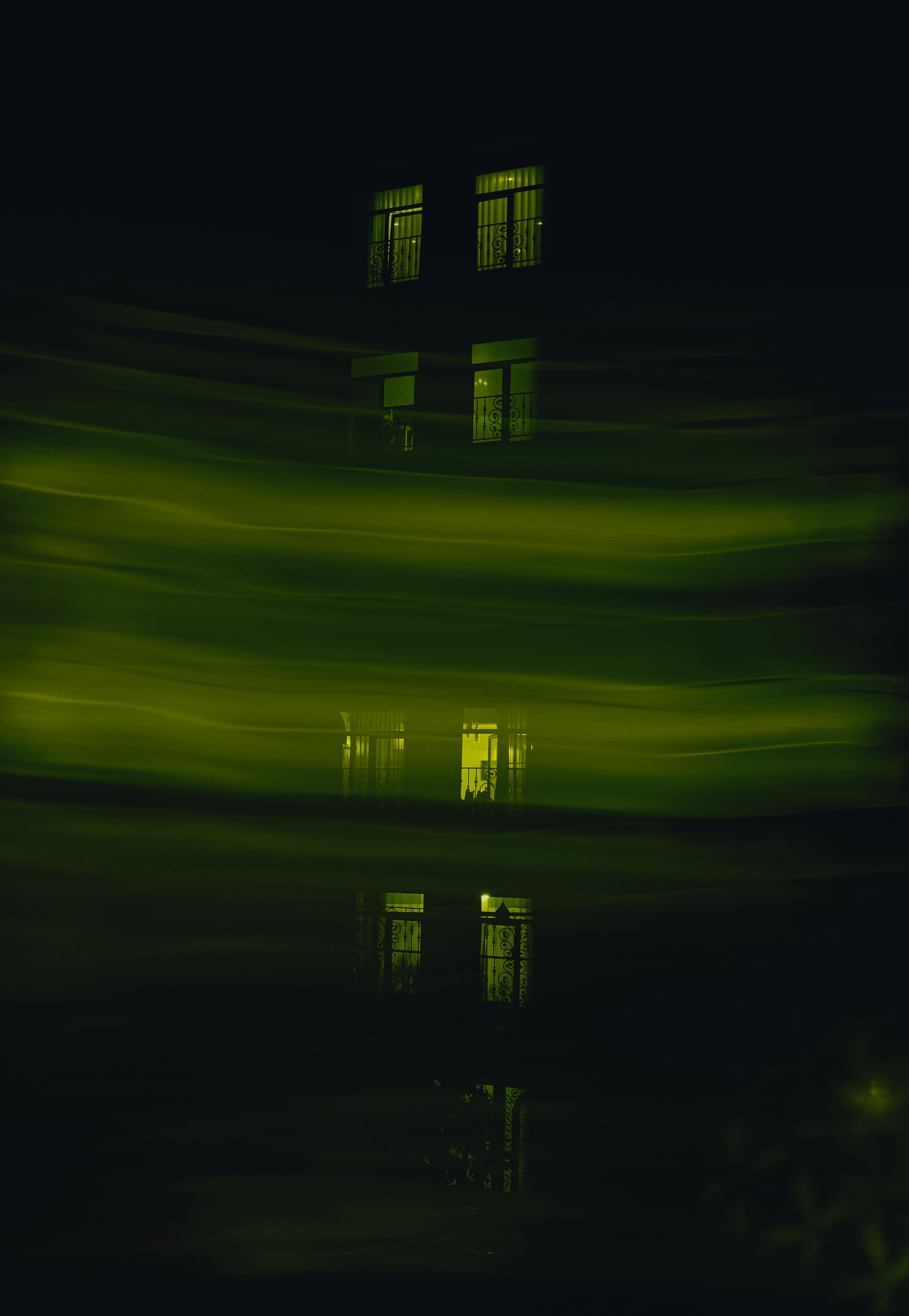 a building with a reflection of it in the water