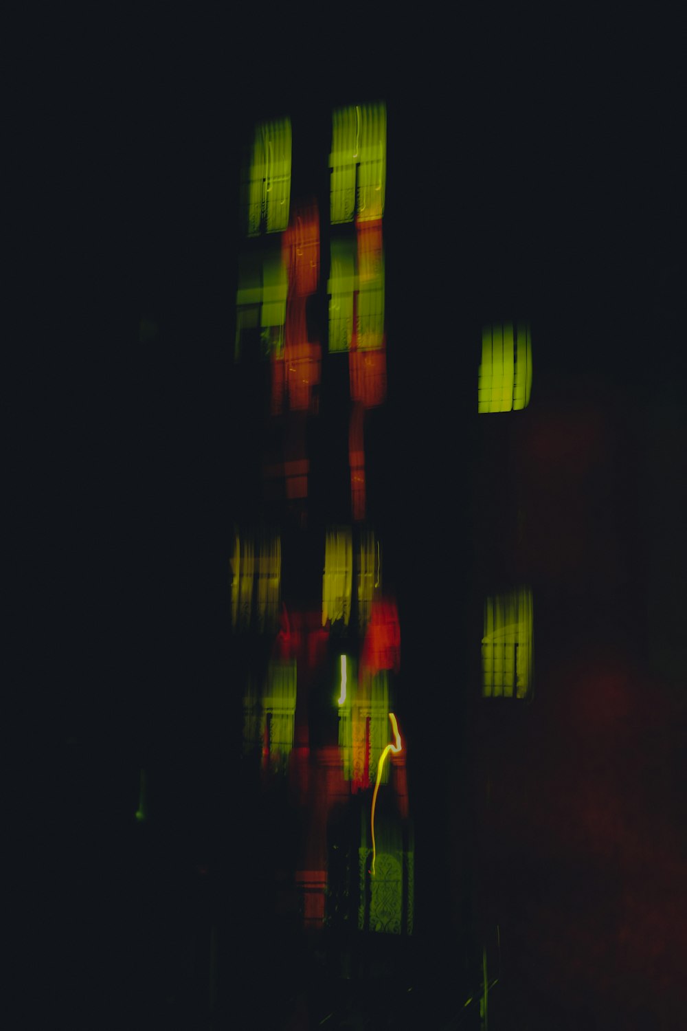 a blurry photo of a building with a red light