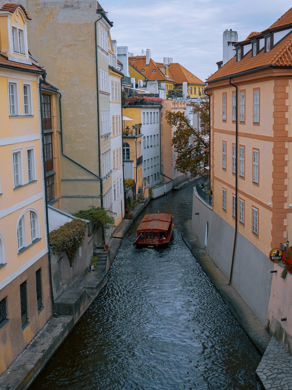 a river running through a city next to tall buildings