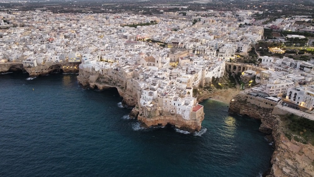 an aerial view of a city by the ocean