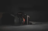 a sony camera sitting on top of a bed