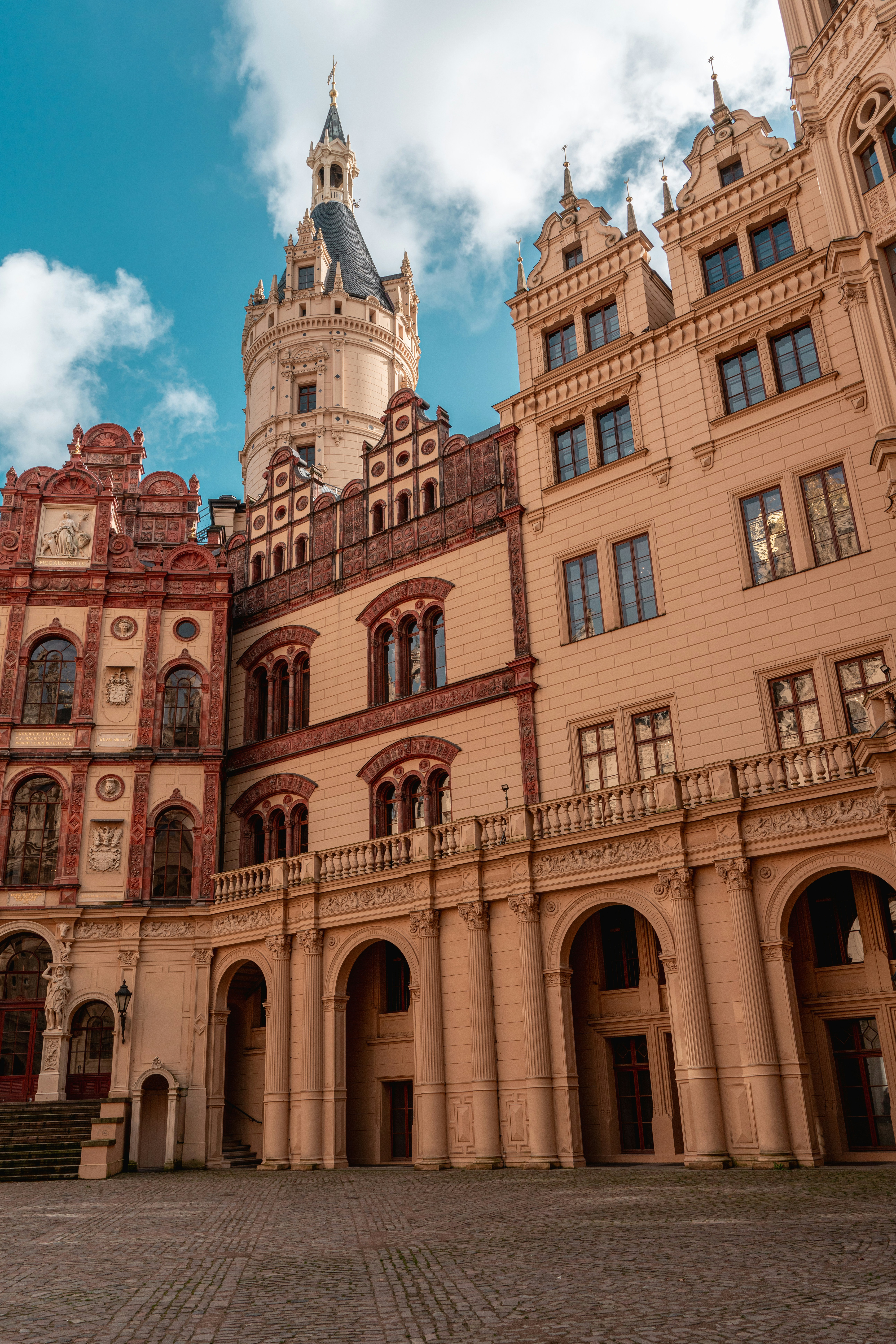A large building with a clock on the top of it photo – Free Castle ...
