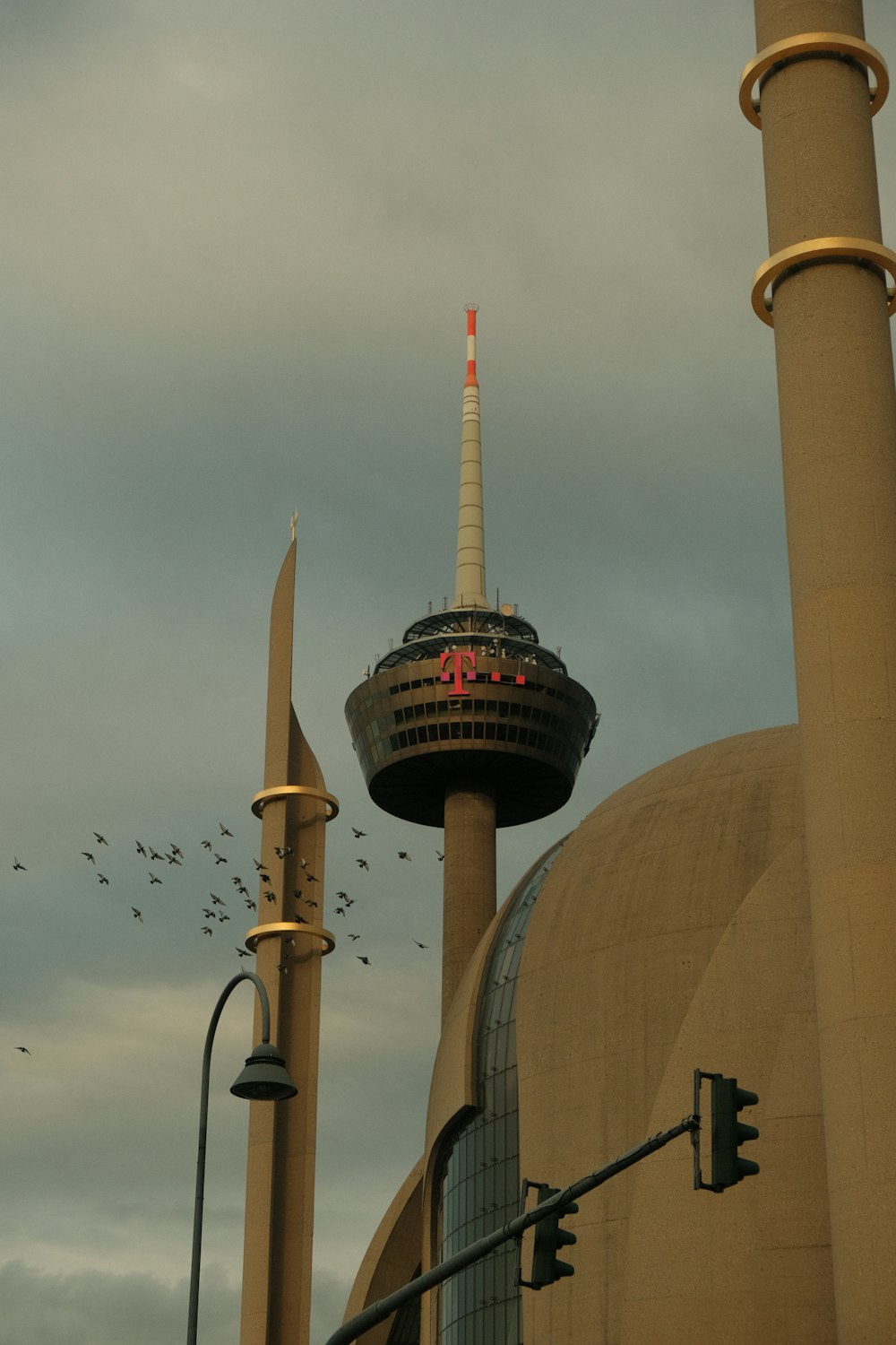 a very tall building with a very tall tower in the background