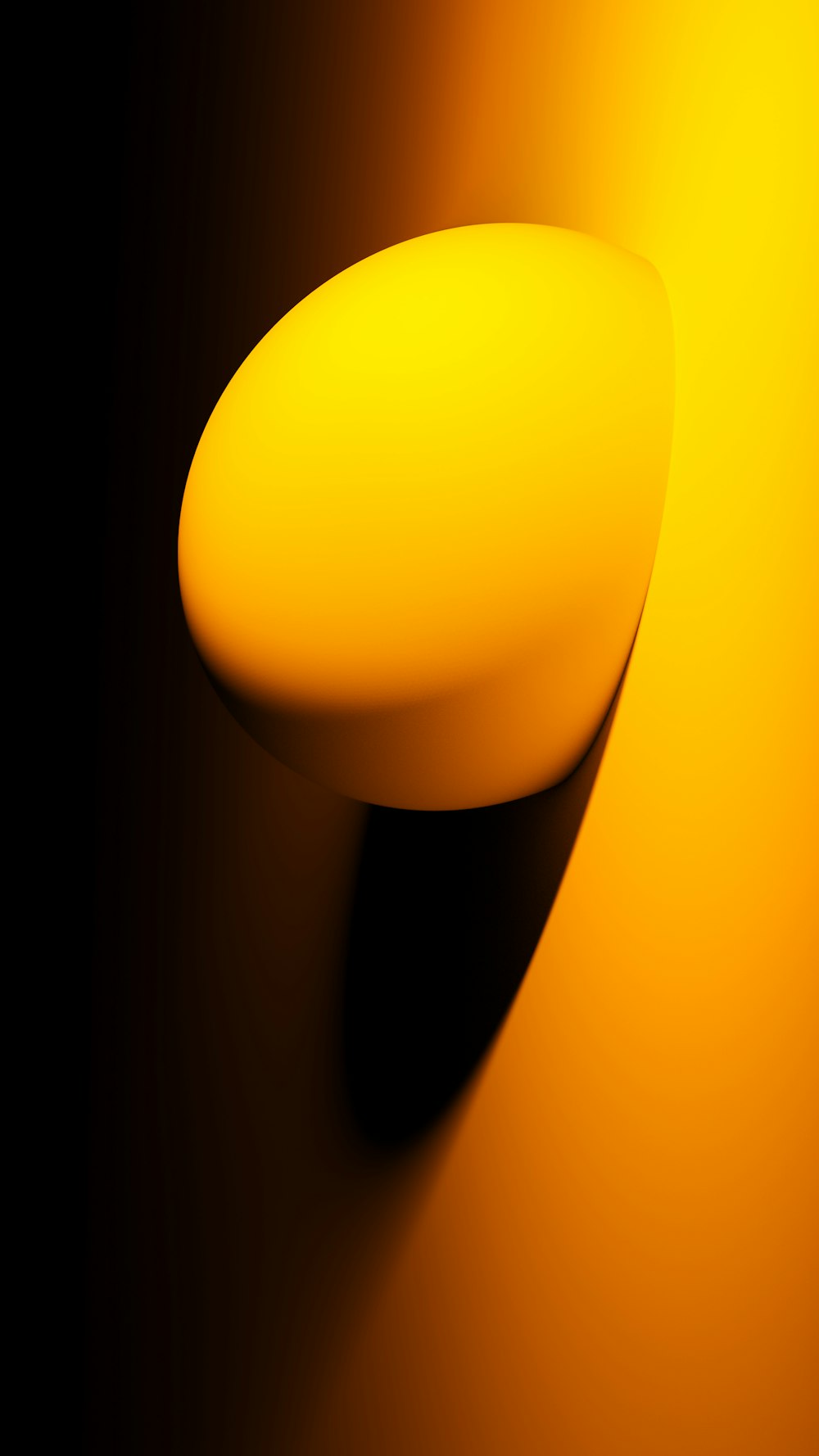 a close up of a yellow object on a black background
