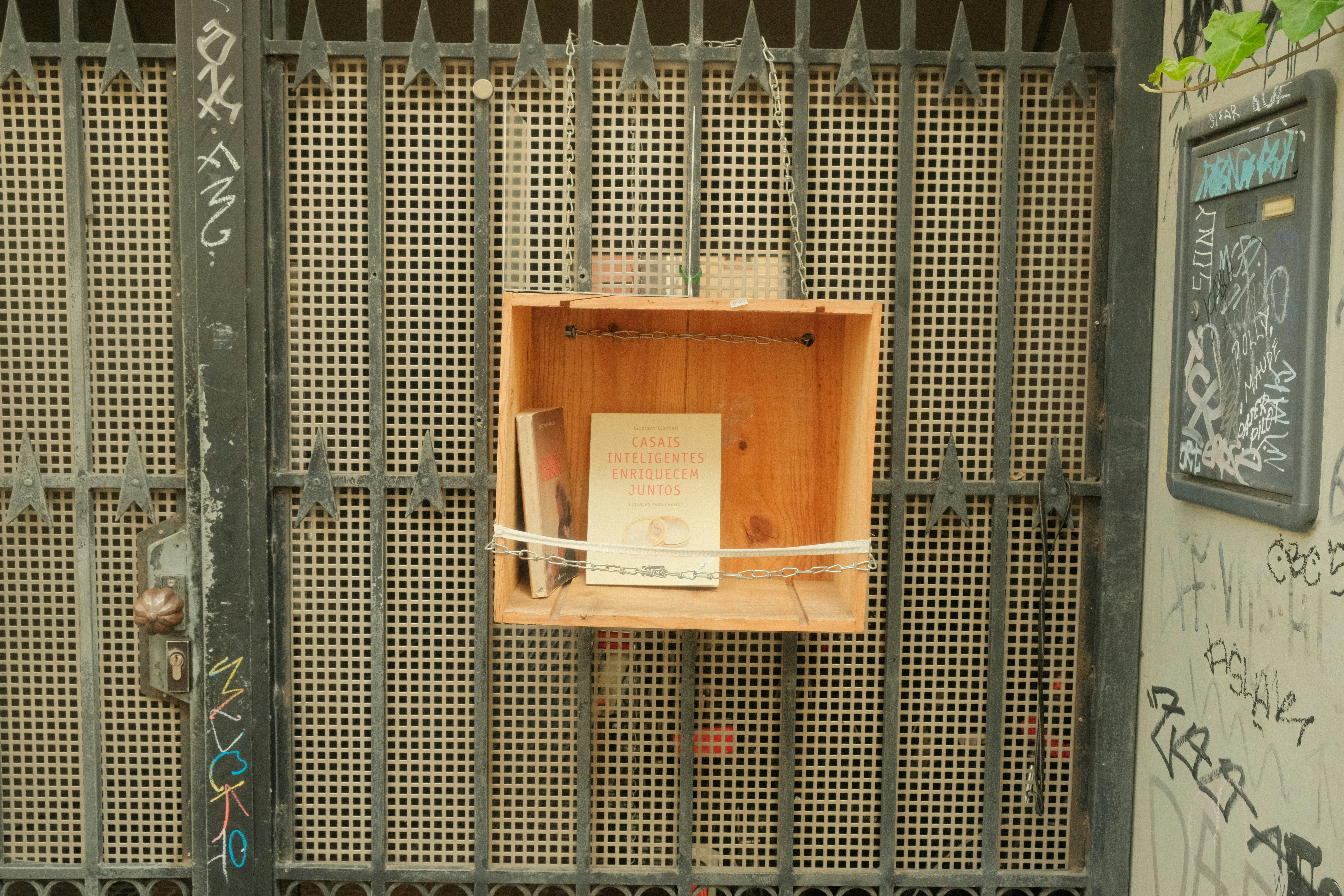 a wooden box with a sign attached to it