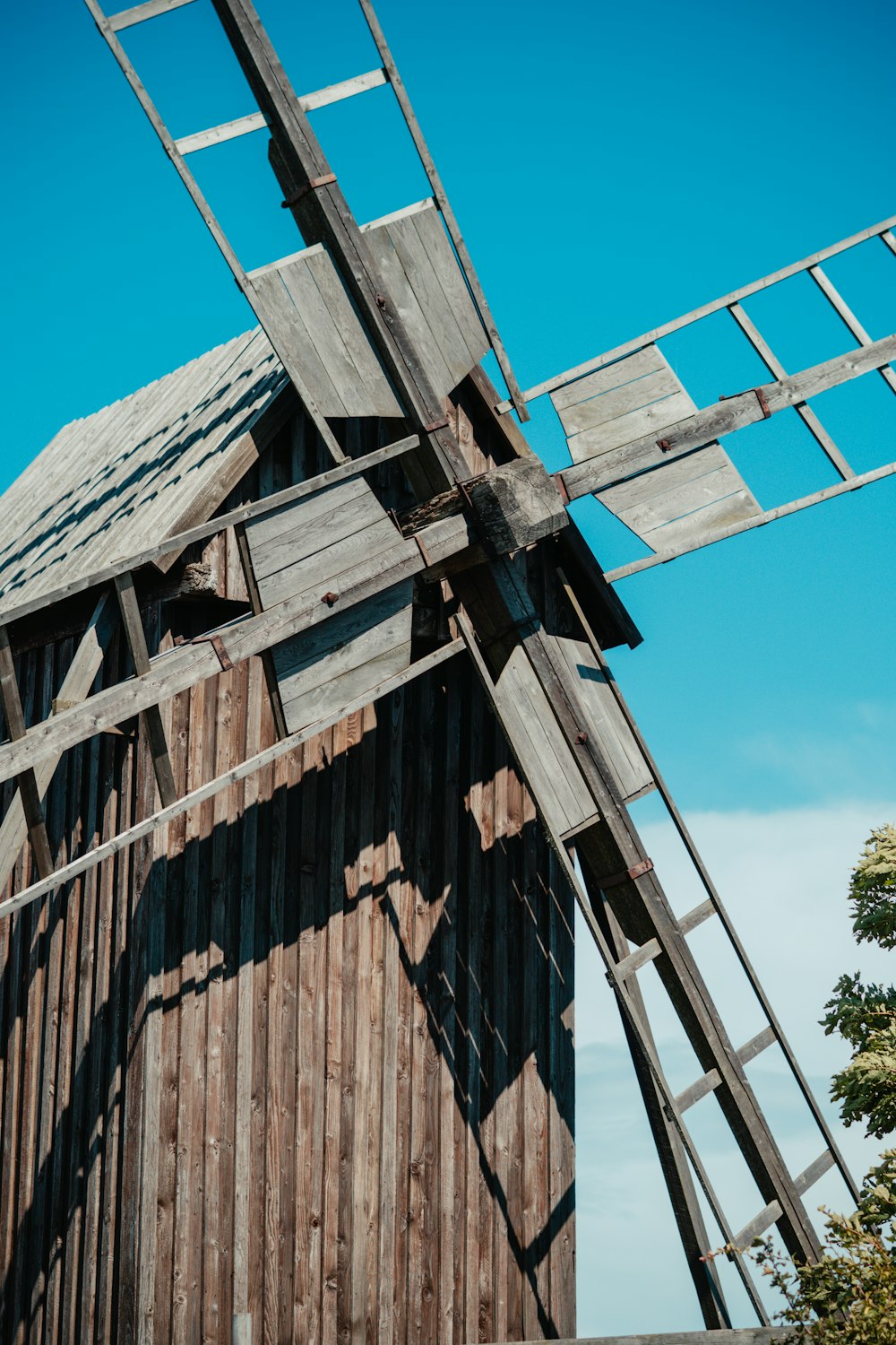 a wooden structure with a ladder attached to it