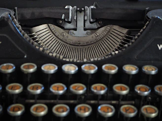 a close up of an old fashioned typewriter