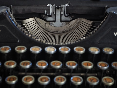 A vintage typewriter being carefully restored by a technician.