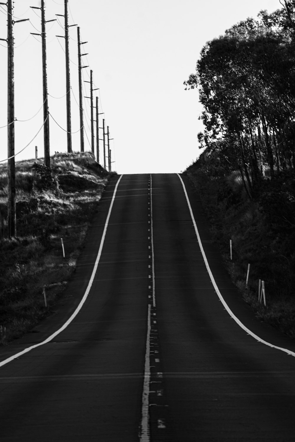 a black and white photo of an empty road