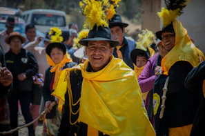 A vibrant traditional music gathering in the Llanos Orientales, with colorful attire and joyful expressions celebrating Colombian heritage.