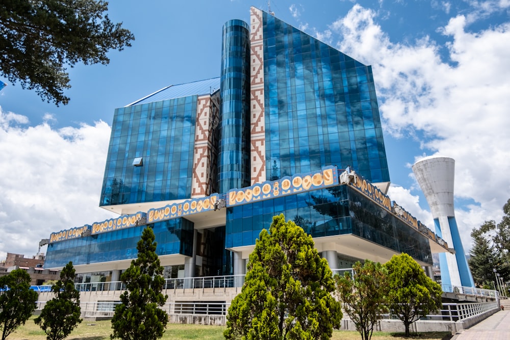 a large blue building with a sky background