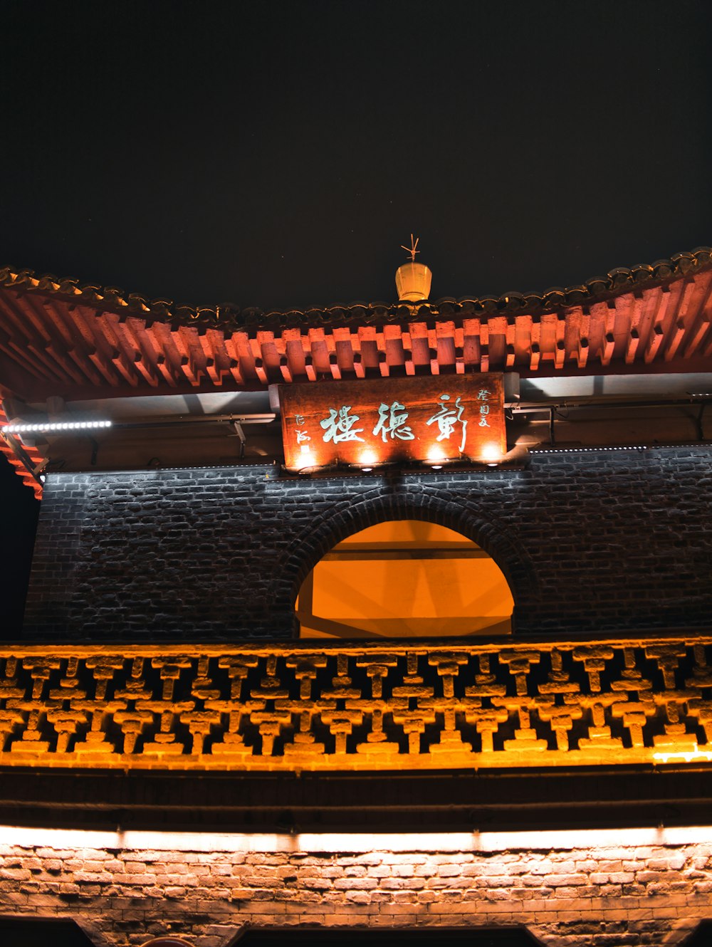 a building with a lit up sign above it