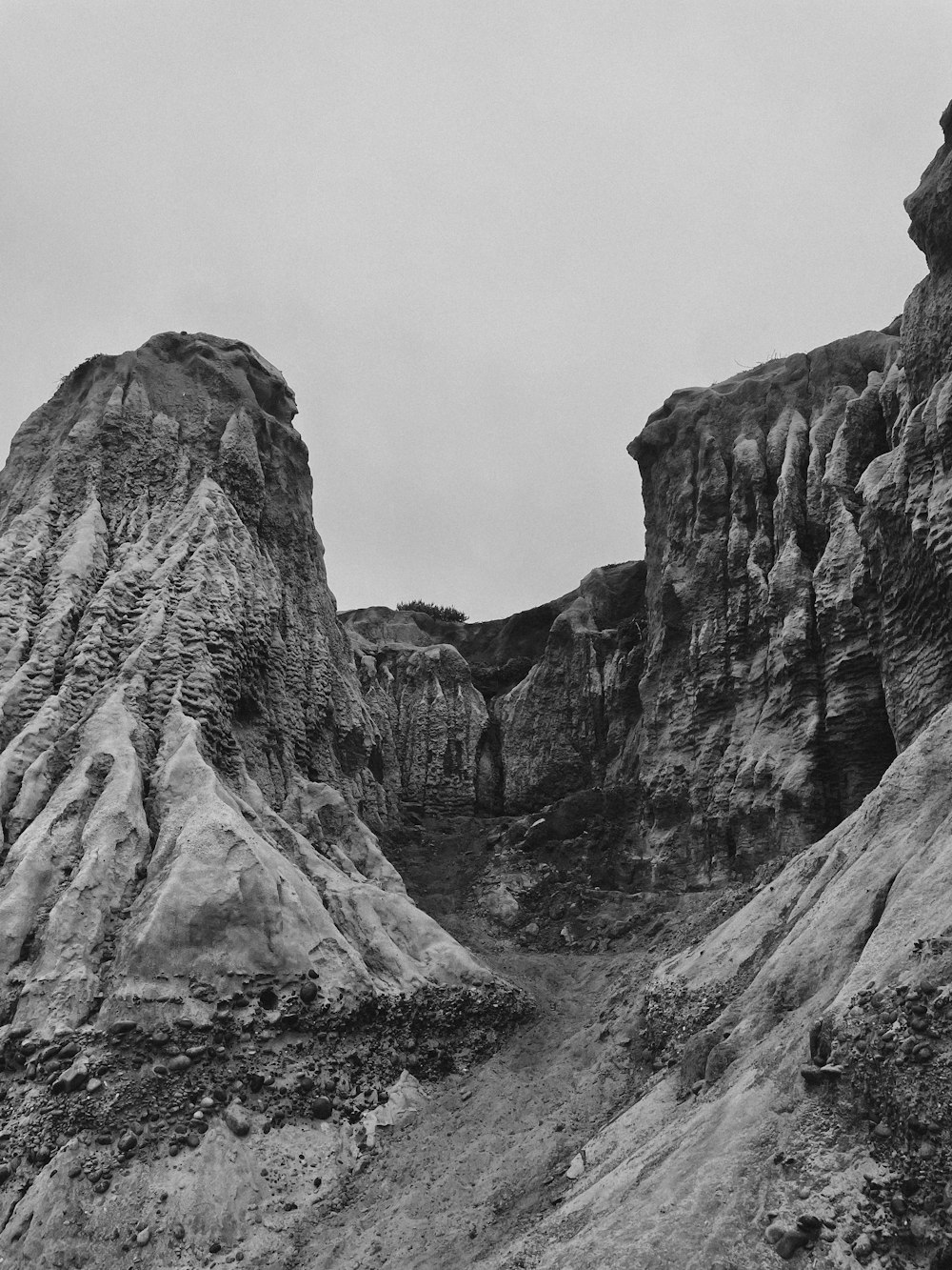 a black and white photo of a rocky landscape