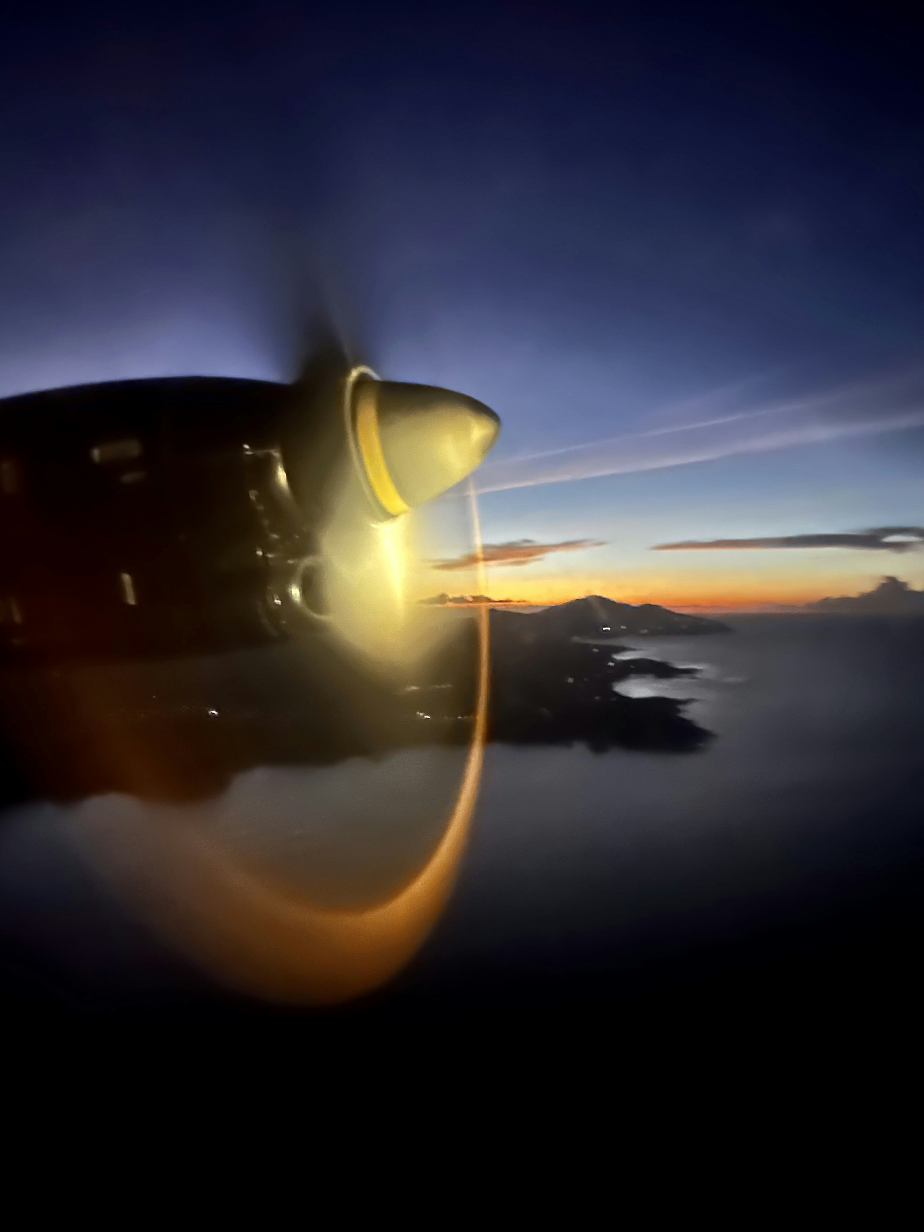 a view of the wing of an airplane in the sky