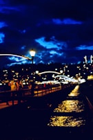 Evening lights of the lively boardwalk with shops and eateries glowing warmly.