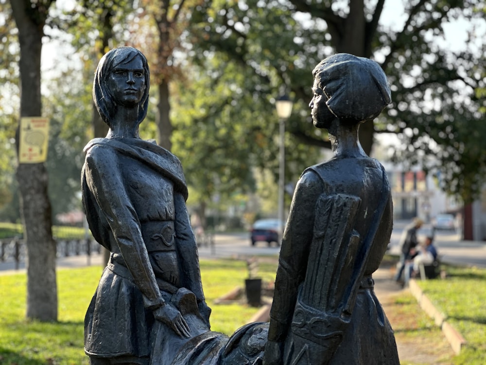 a statue of two people standing next to each other