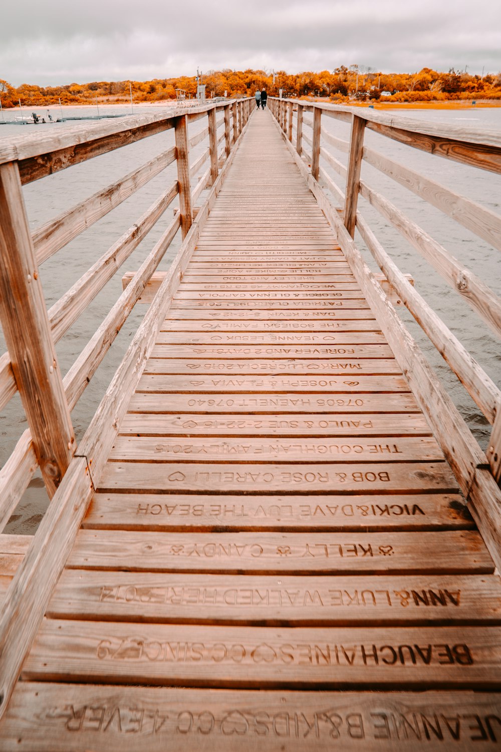 a wooden bridge that has writing on it