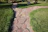Close-up of a beautifully crafted stone pathway winding through a vibrant garden.