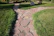 Close-up of a beautifully crafted stone pathway winding through a vibrant garden.