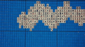 Golden dragon coiled around Mahjong tiles glowing under casino lights