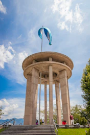 a monument with a flag on top of it