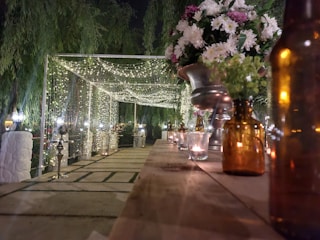 Outdoor garden party with fairy lights and rustic decorations.