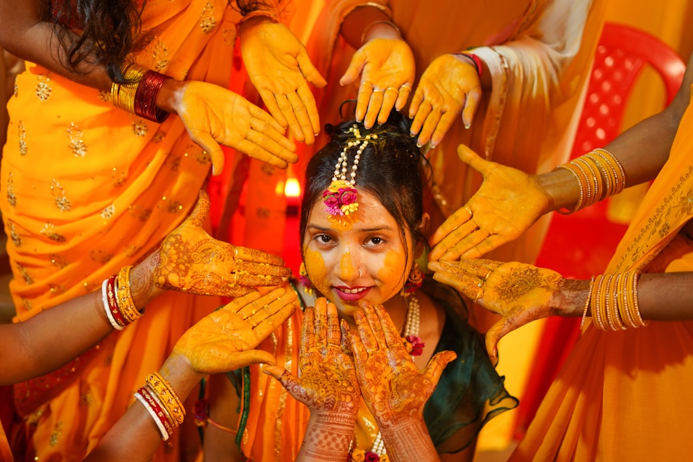 a young girl is getting her face painted