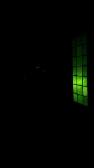 A dark, tactical map overlay glowing with neon green highlights and night-vision style grid lines.