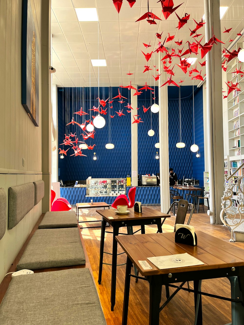 a room filled with lots of wooden tables and chairs