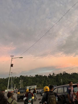 Community gathering for road safety awareness with motorcycles and families