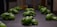 Several small green plants are growing on a flat, dark surface, likely part of a hydroponic or indoor garden setup. The plants are arranged in neat rows and are well-lit, highlighting their healthy green leaves.