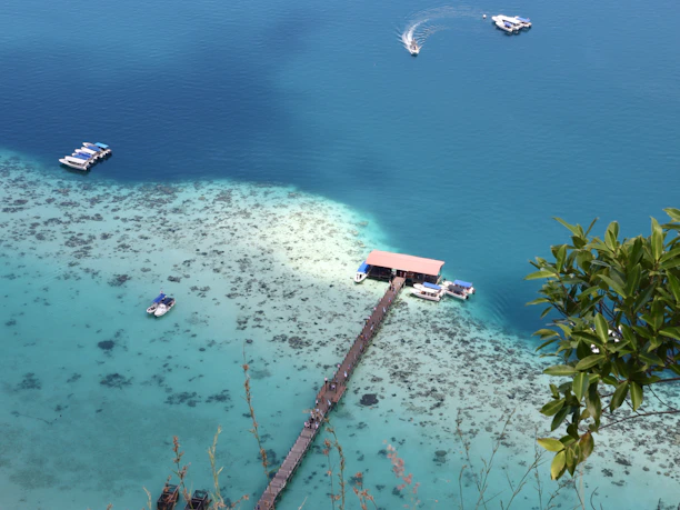 several boats floating on a body of water