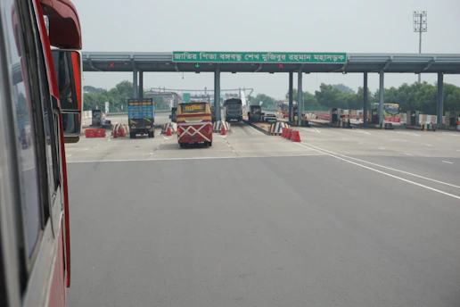 Close-up of a digital toll gate display showing different vehicle categories and rates.