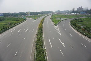 Wide shot of a traffic management plan in action with clear lane markings and directional signs.
