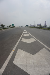 Aerial view of a highway with clear, long-lasting road markings stretching into the distance.