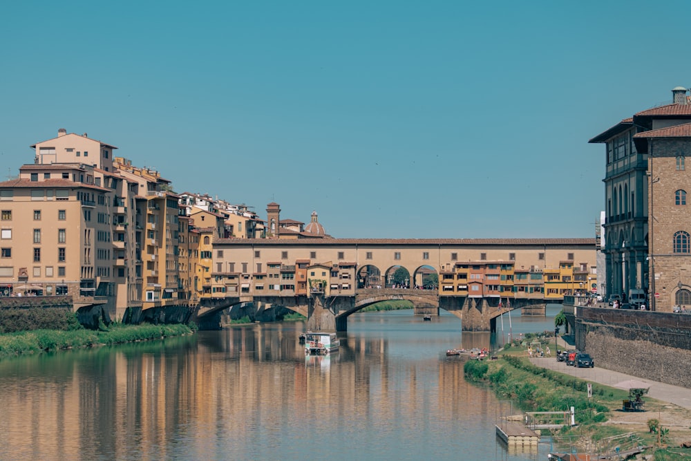 a river running through a city next to tall buildings