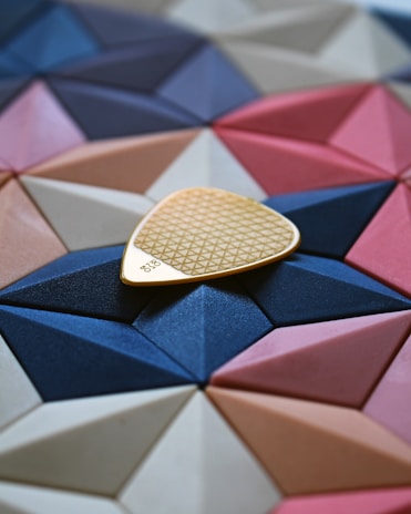 A close-up of a unique pickup stick design showcasing intricate patterns.