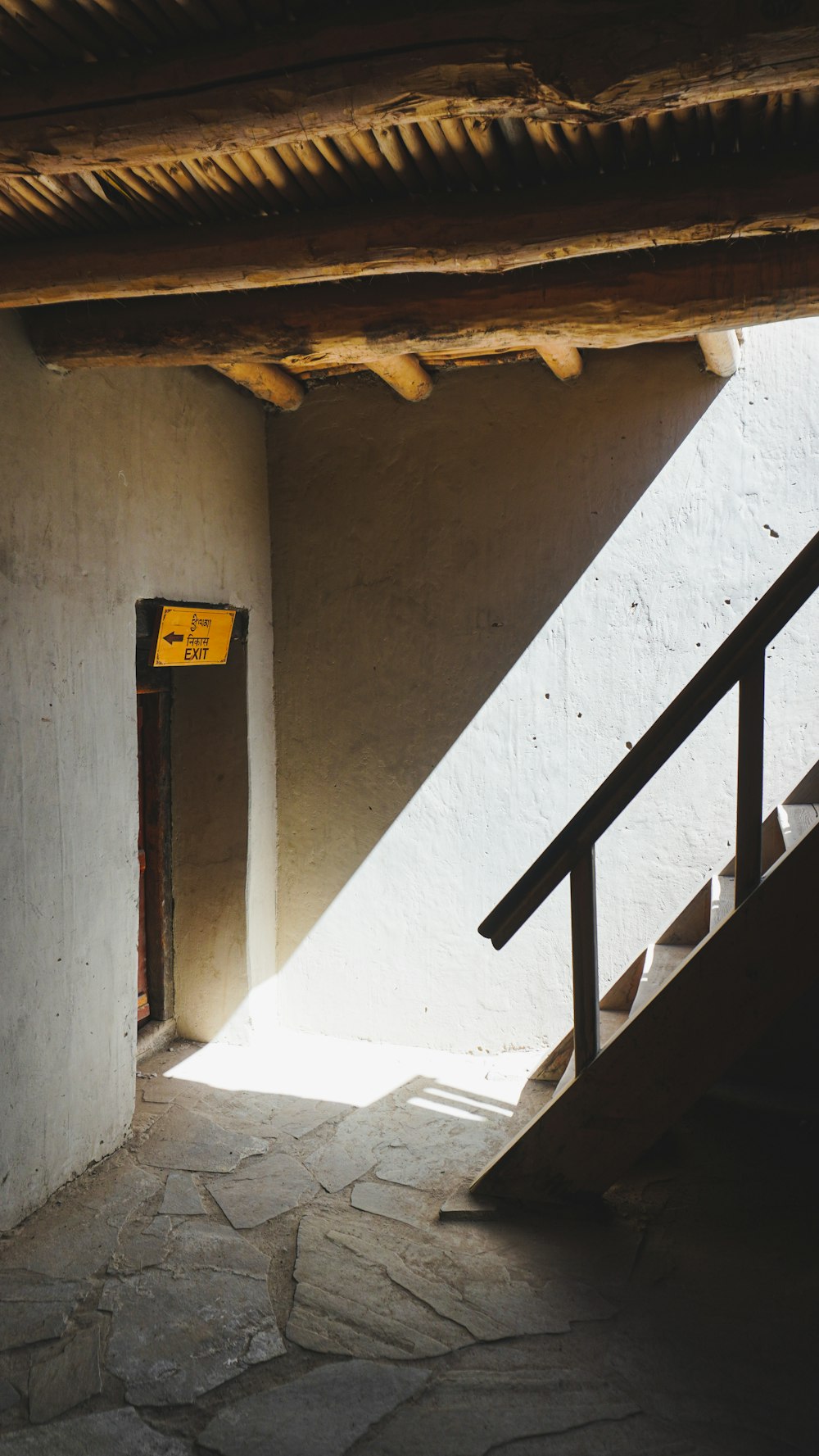 a yellow sign on the side of a building